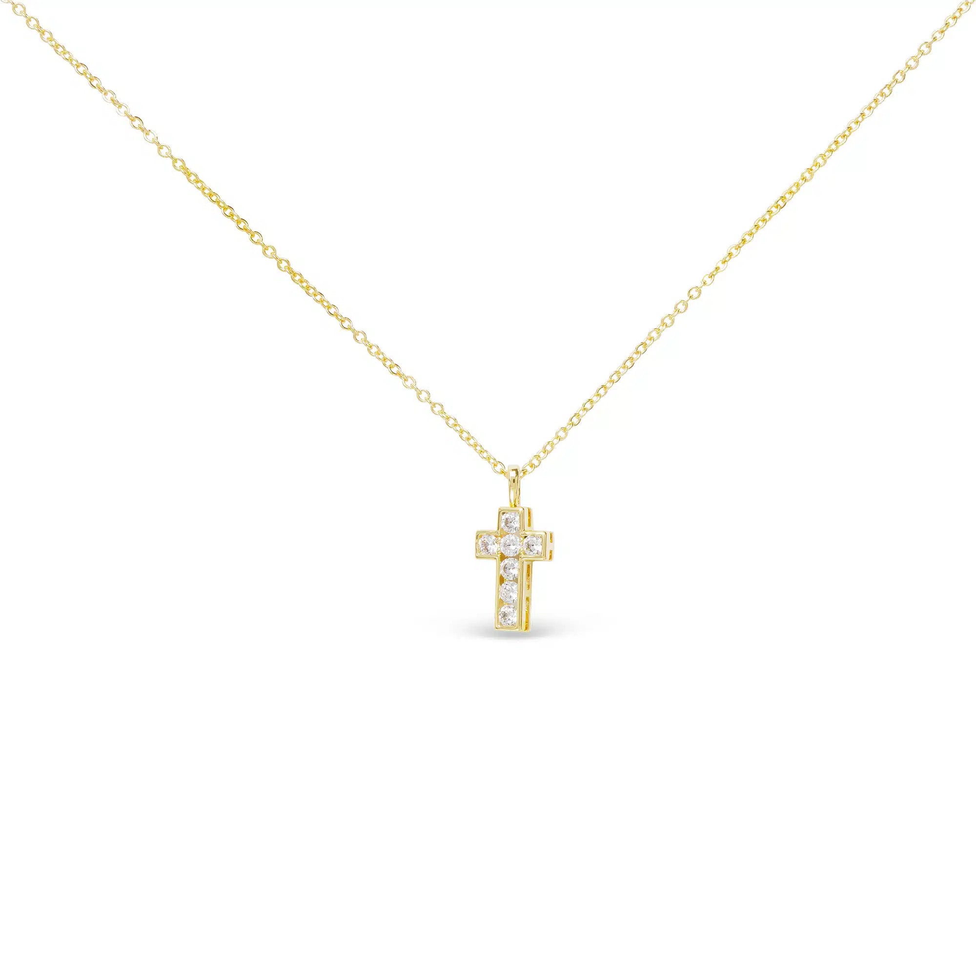 Gold CZ small framed cross necklace with shimmering stones on a delicate gold chain.