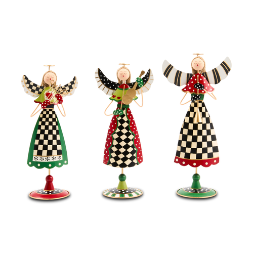 Three decorative tin angels with checkered patterns and musical instruments on round stands.