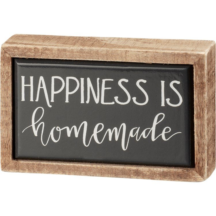 Wooden framed box sign with black background and white text reading 'Happiness is homemade'.