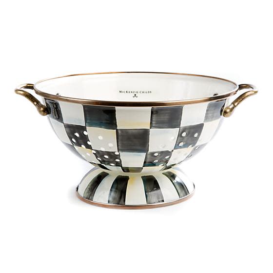 Large Courtly Check enamel colander with hand-painted blue pattern on steel body and antiqued brass handles.