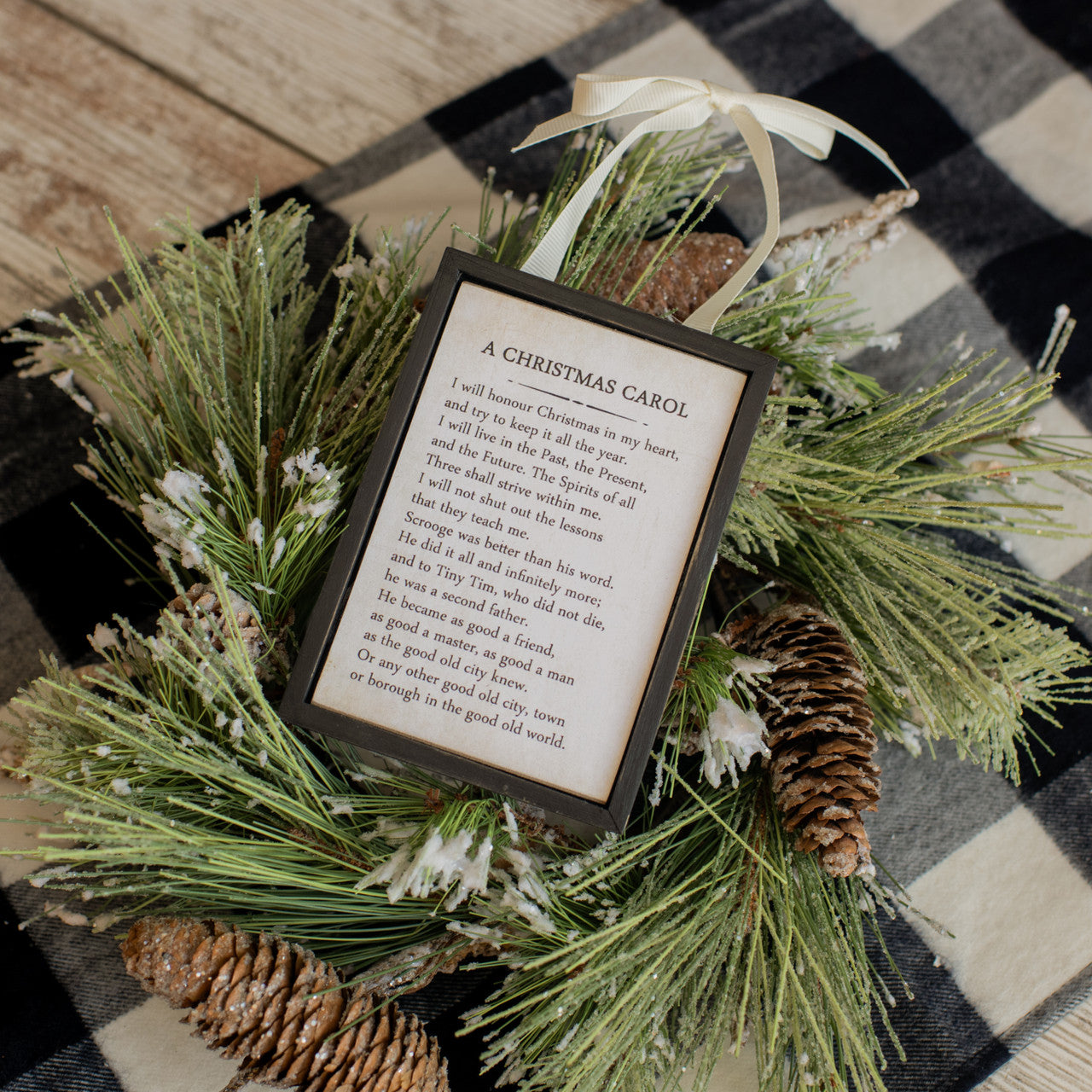 Wooden sign ornament shaped like a lowercase 'x' with natural grain texture.