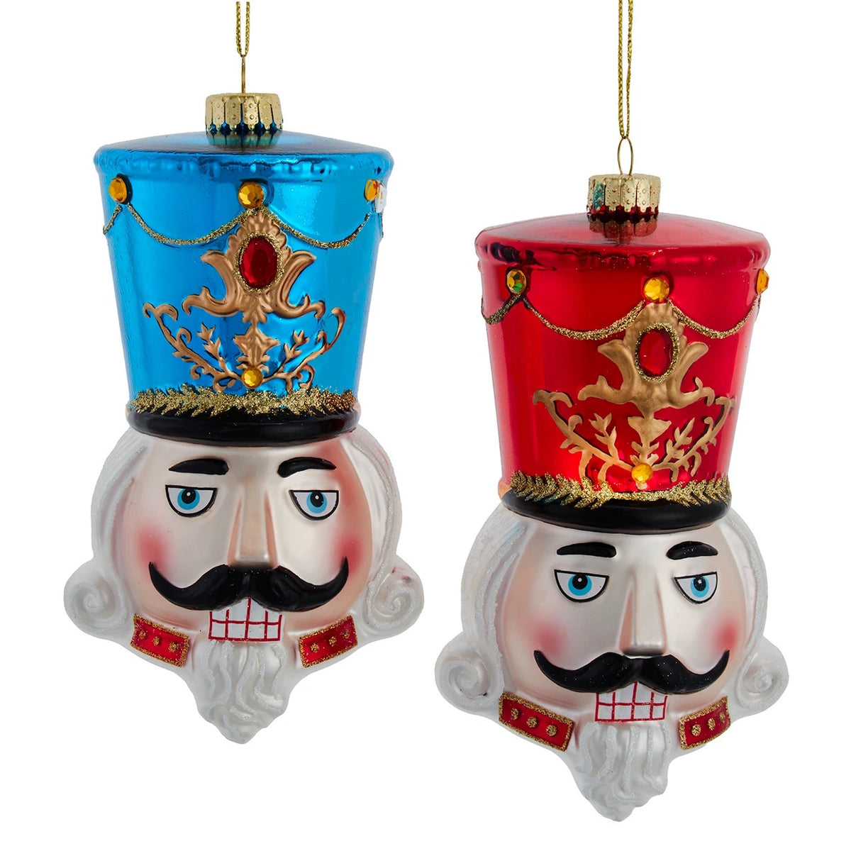 Two 7-inch glass nutcracker head ornaments with blue and red hats and glittery gold accents.