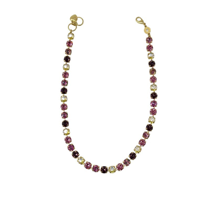 Gold Florence necklace featuring a strand of round pink, purple, and yellow crystals.