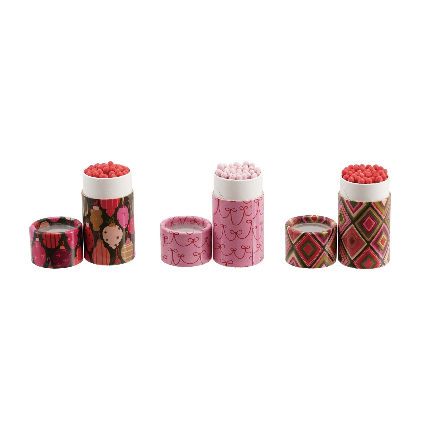 Three sets of safety matches in decorative holiday-patterned tubes with matching lids.
