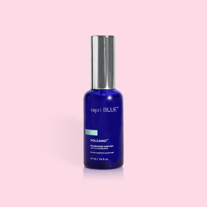 Capri Blue Volcano Fragranced Hair Mist in a 1.6 fl oz blue glass bottle with a silver cap.