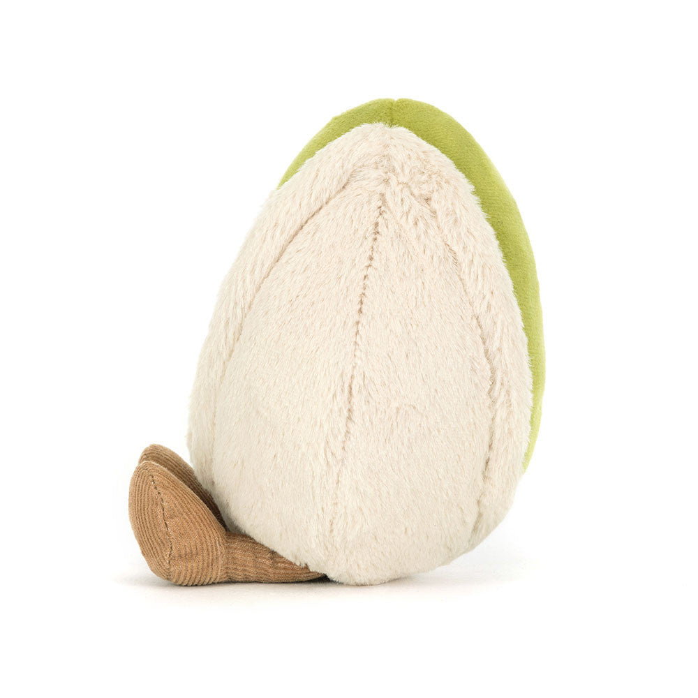 Back view of a plush pistachio nut toy with a green shell, cream center, and brown corduroy legs.
