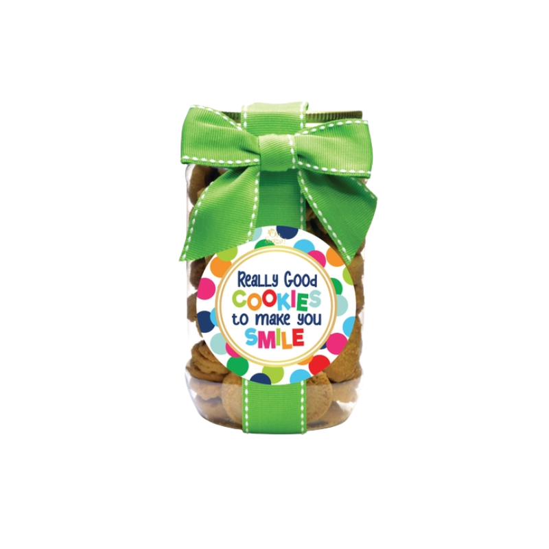 Pint-sized cookie jar with a green ribbon and a colorful polka dot label that says Smile.