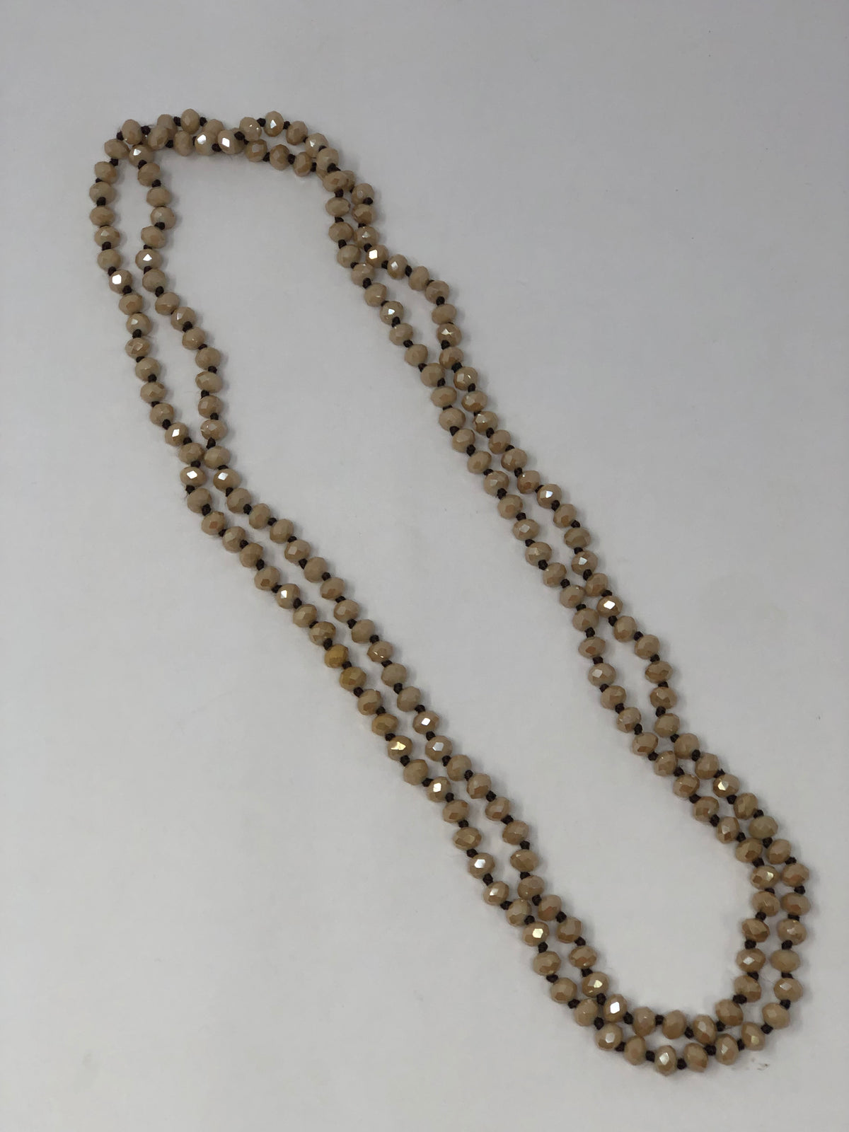 60-inch dark brown crystal beaded necklace with knotting between beads and no clasp