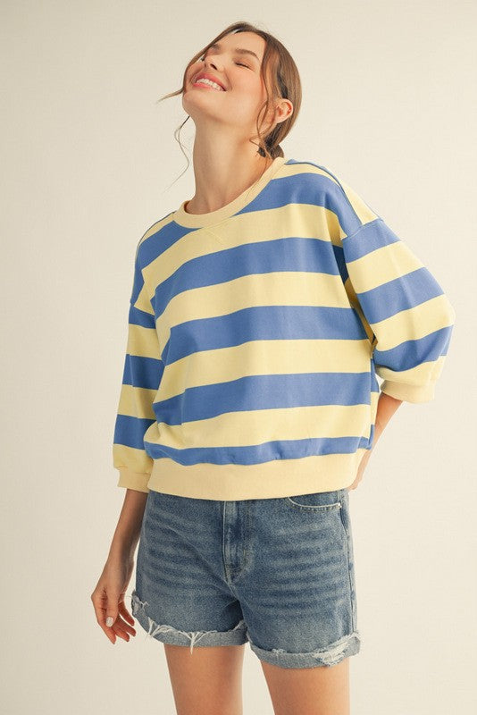 Roxanne V-neck casual top in bold stripe print with a relaxed silhouette made from cotton and polyester blend.