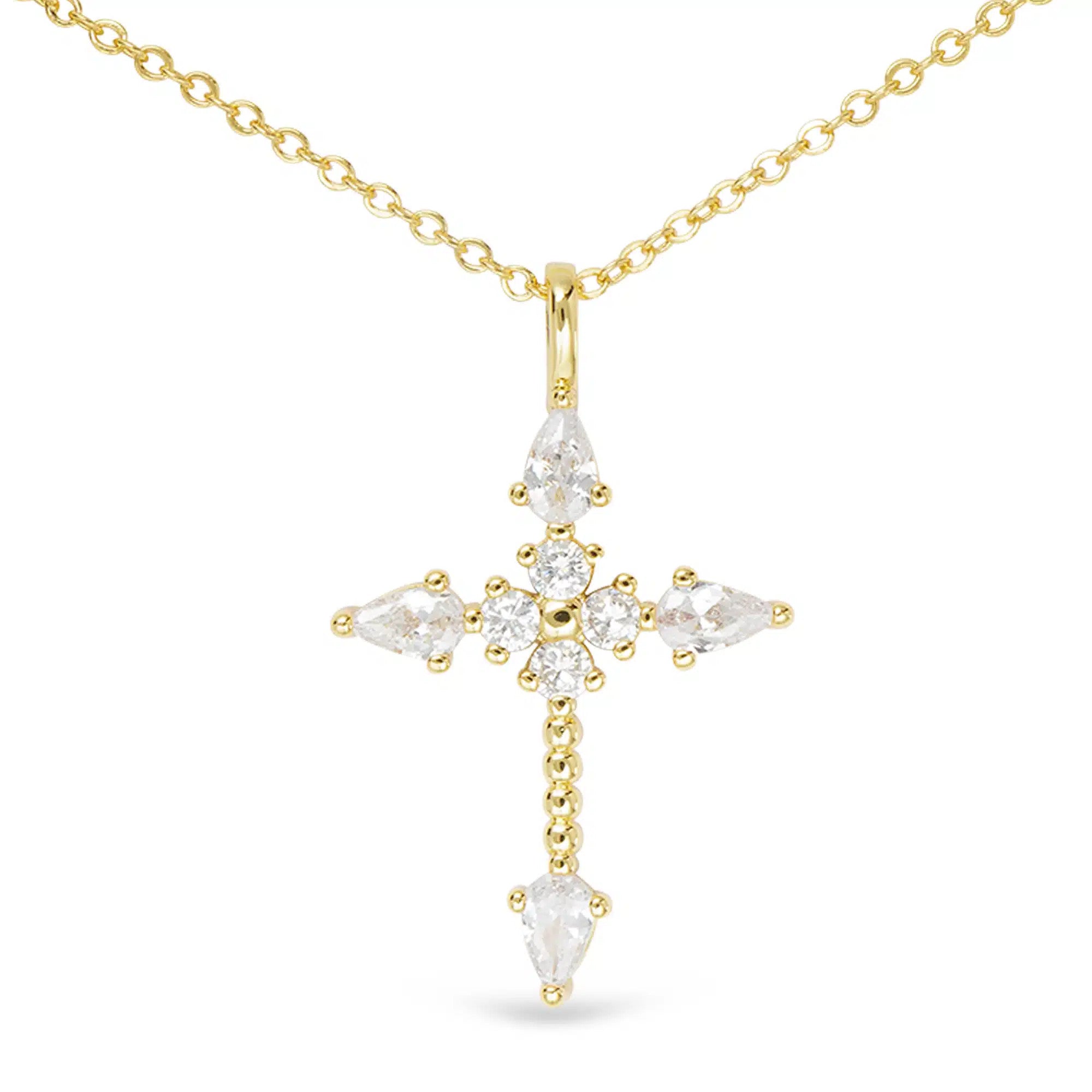 Gold cross necklace with pear-shaped and round cubic zirconia stones on a delicate chain.
