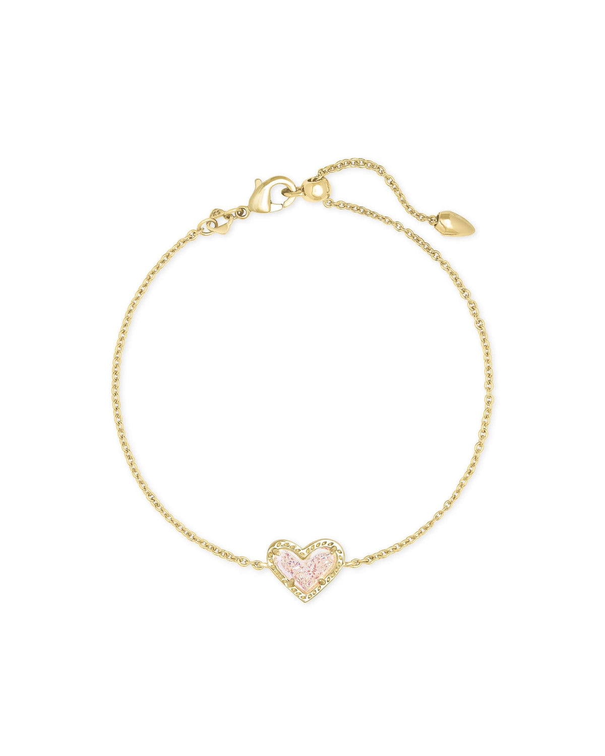 Rose quartz heart pendant on an adjustable yellow gold chain bracelet with asymmetrical silhouette.