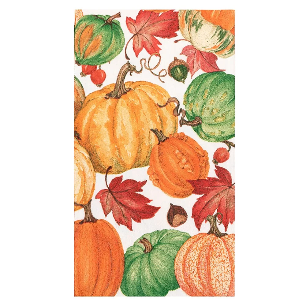Caspari Pumpkin Field White Guest Towel featuring a pattern of pumpkins, autumn leaves, and acorns.