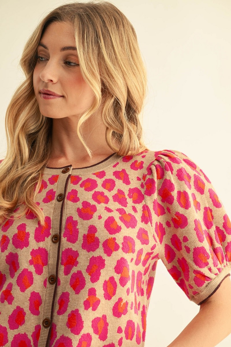 Close-up of the Annie Leopard Sweater Cardigan in tan with pink and orange leopard print.