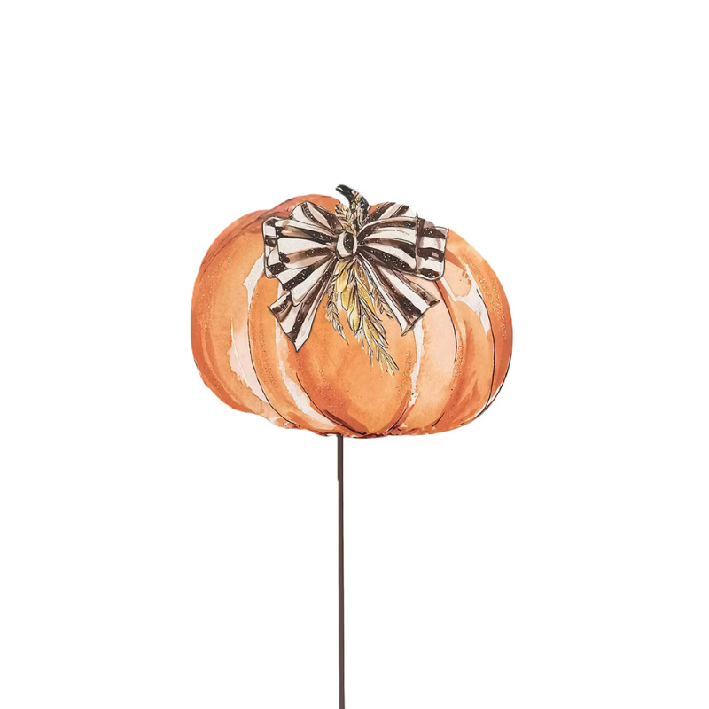 Orange metal pumpkin garden stake with a black and white striped bow and wheat accents.
