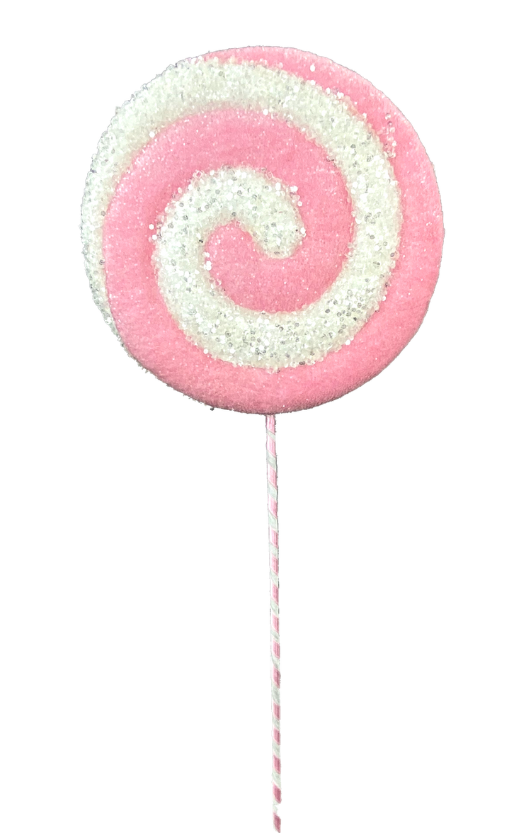 Red lollipop pick decoration with white polka dots on a clear stand.