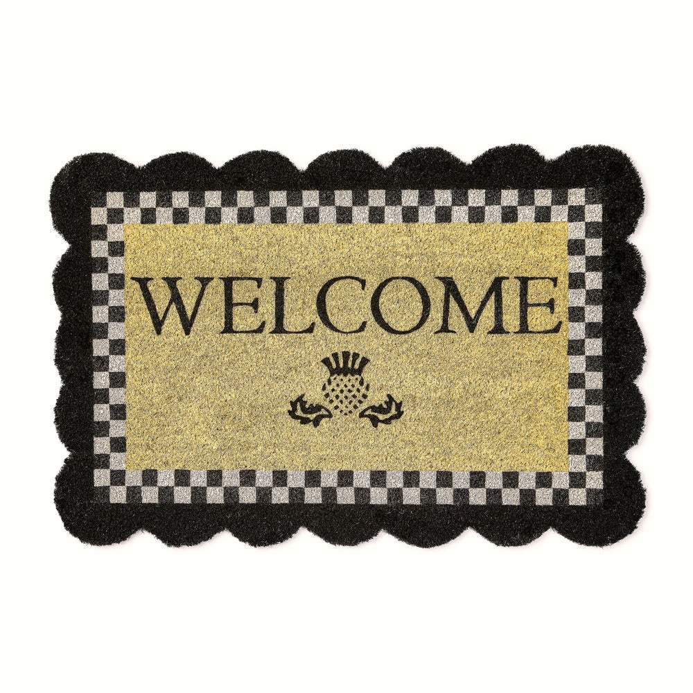 Scalloped welcome entrance mat made with coir and PVC in a natural brown color.