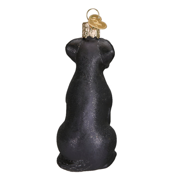 Back view of a black Labrador glass Christmas ornament with glitter accents and a gold heart tag.