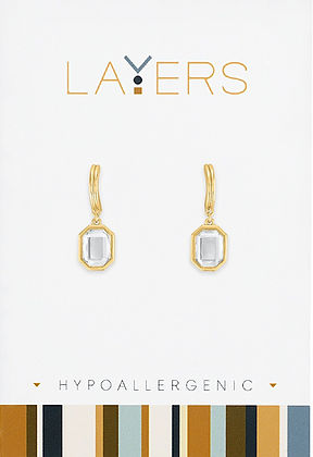 Gold huggie earrings with emerald cut cubic zirconia stones in layered hoops.