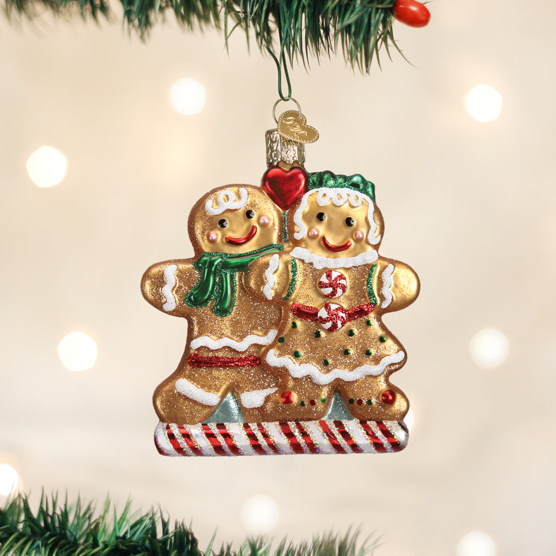 Mouth-blown glass gingerbread ornament with silver interior paint and glitter.