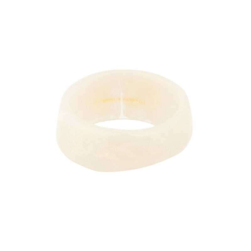 Sally Bangle, a thick, cream-colored resin bracelet with a smooth, rounded finish.