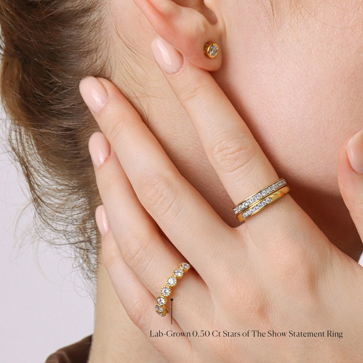 Gold finish statement ring featuring a 0.50 carat lab-grown diamond in a starburst halo setting.