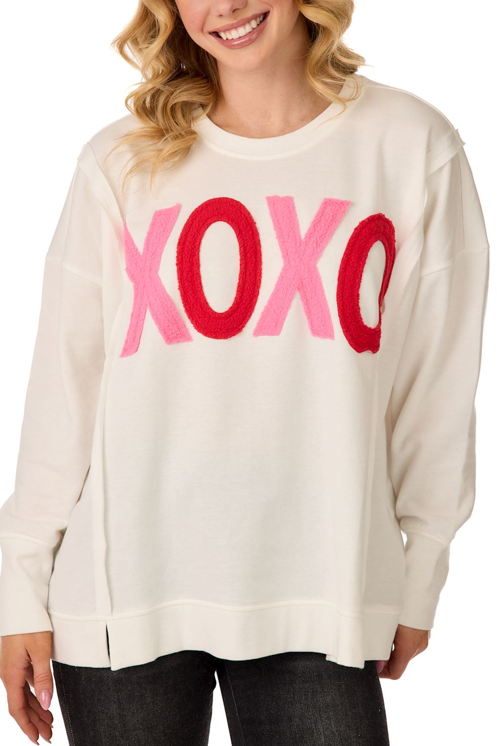 White French terry sweatshirt with pink and red bouclé XOXO appliqué and side slit hem.