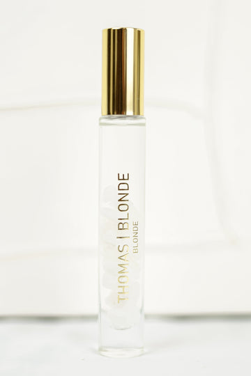 High-Roller unisex perfume stick with a silver metallic body and black cap.