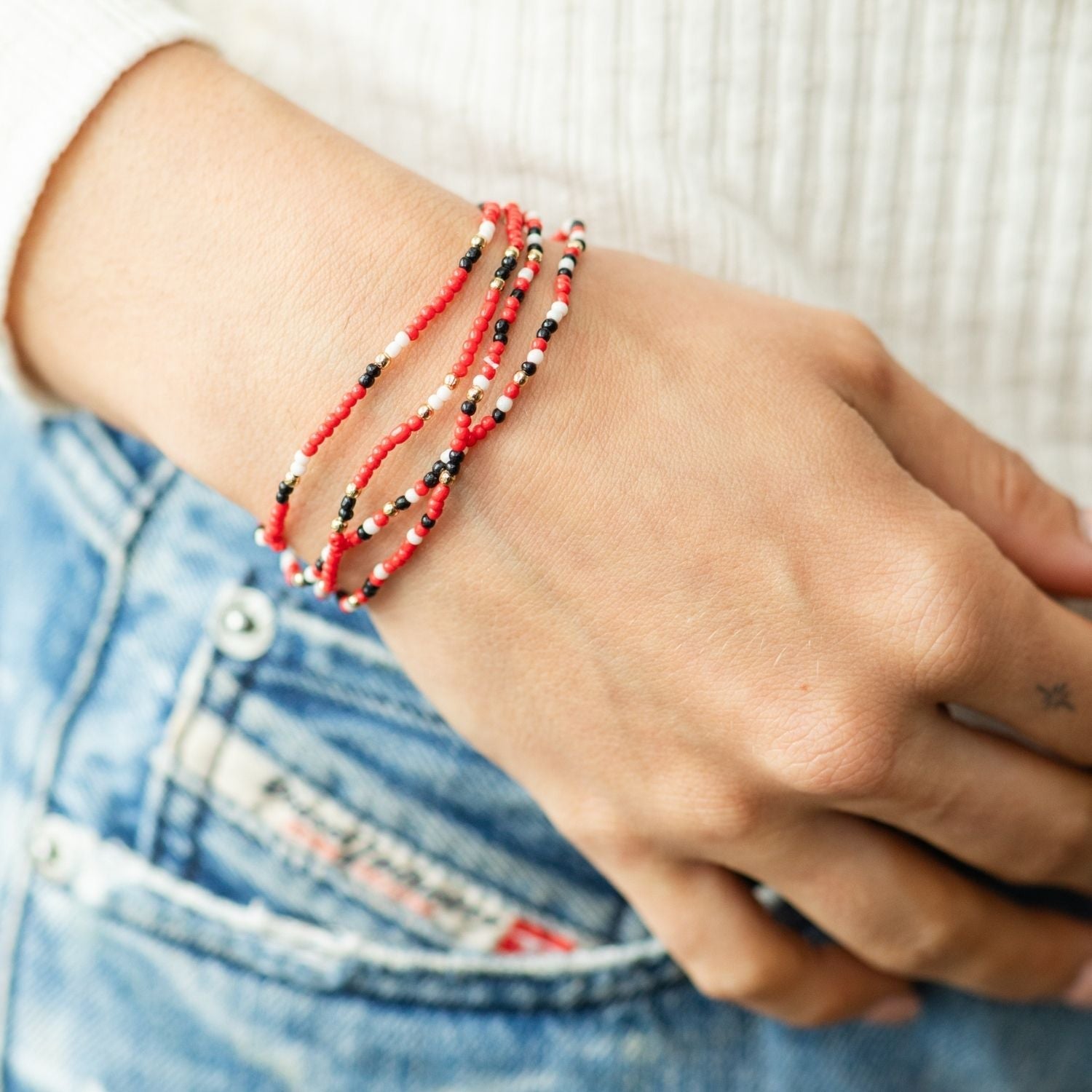 Gold-plated brass stretch bracelet featuring a continuous row of small 2mm seed beads.