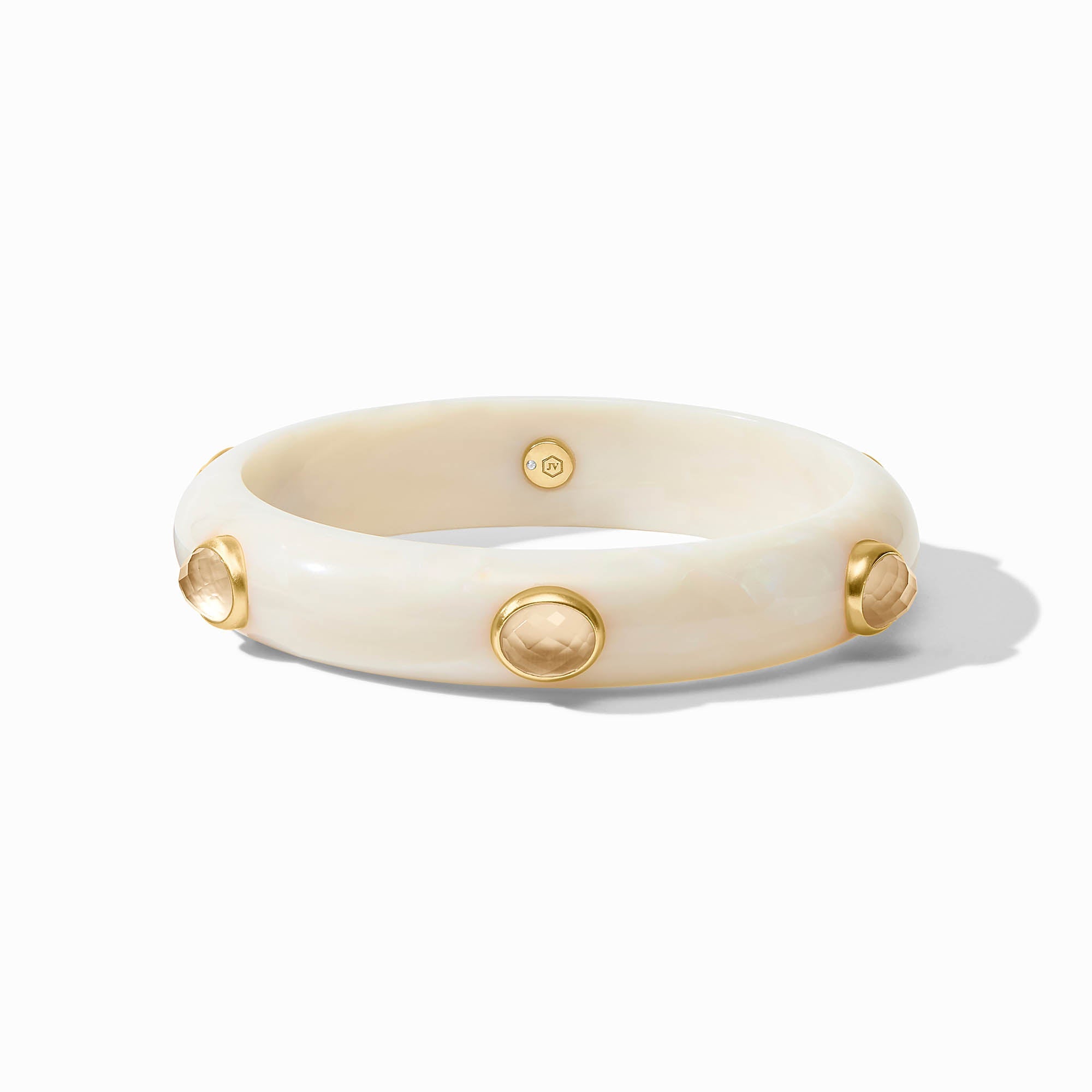 Sleek Carnaby Stone bangle in acetate with a gold plate finish and imported glass accent.