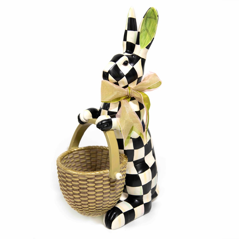Courtly Check Rabbit figurine in black and white checkers holding a gold woven basket with a bow.