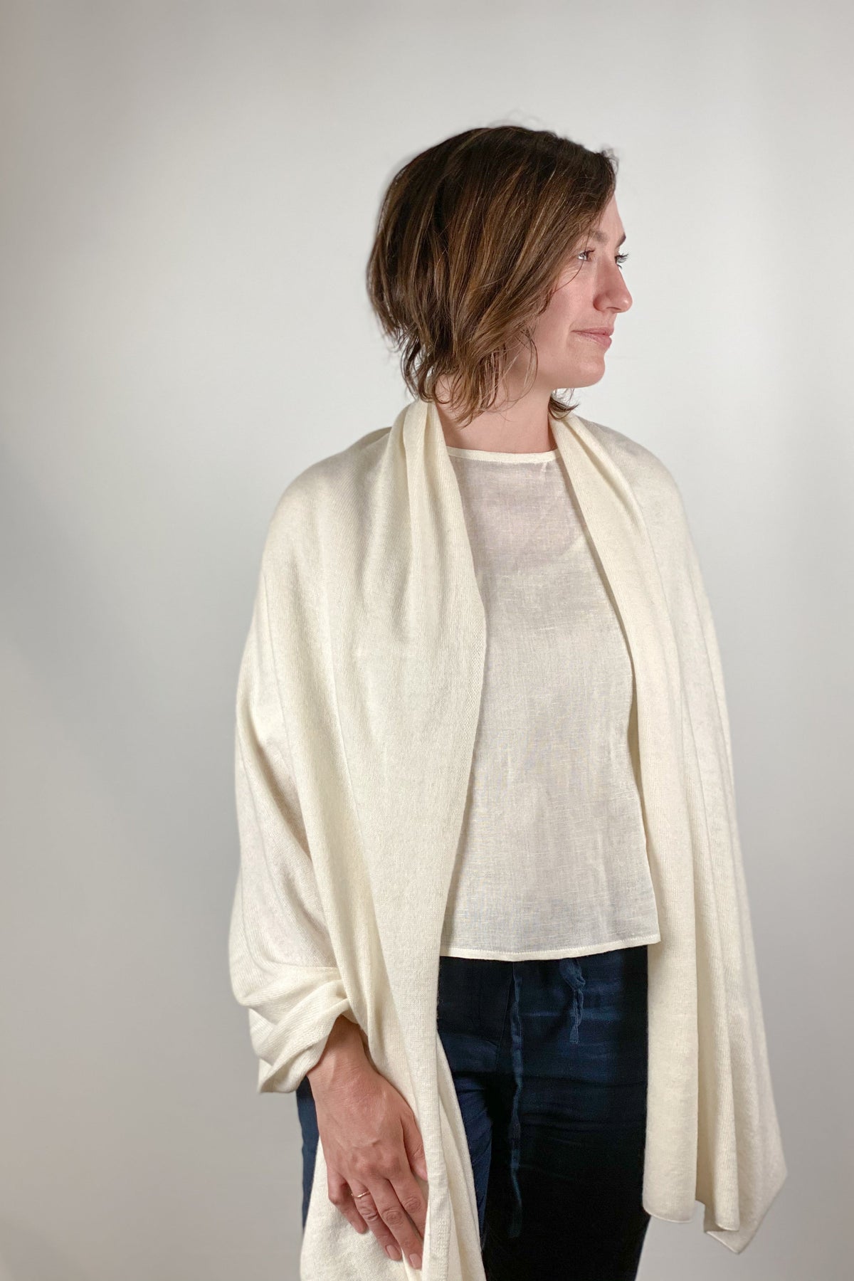 Solid cashmere scarf in a neutral tone with a soft drape.