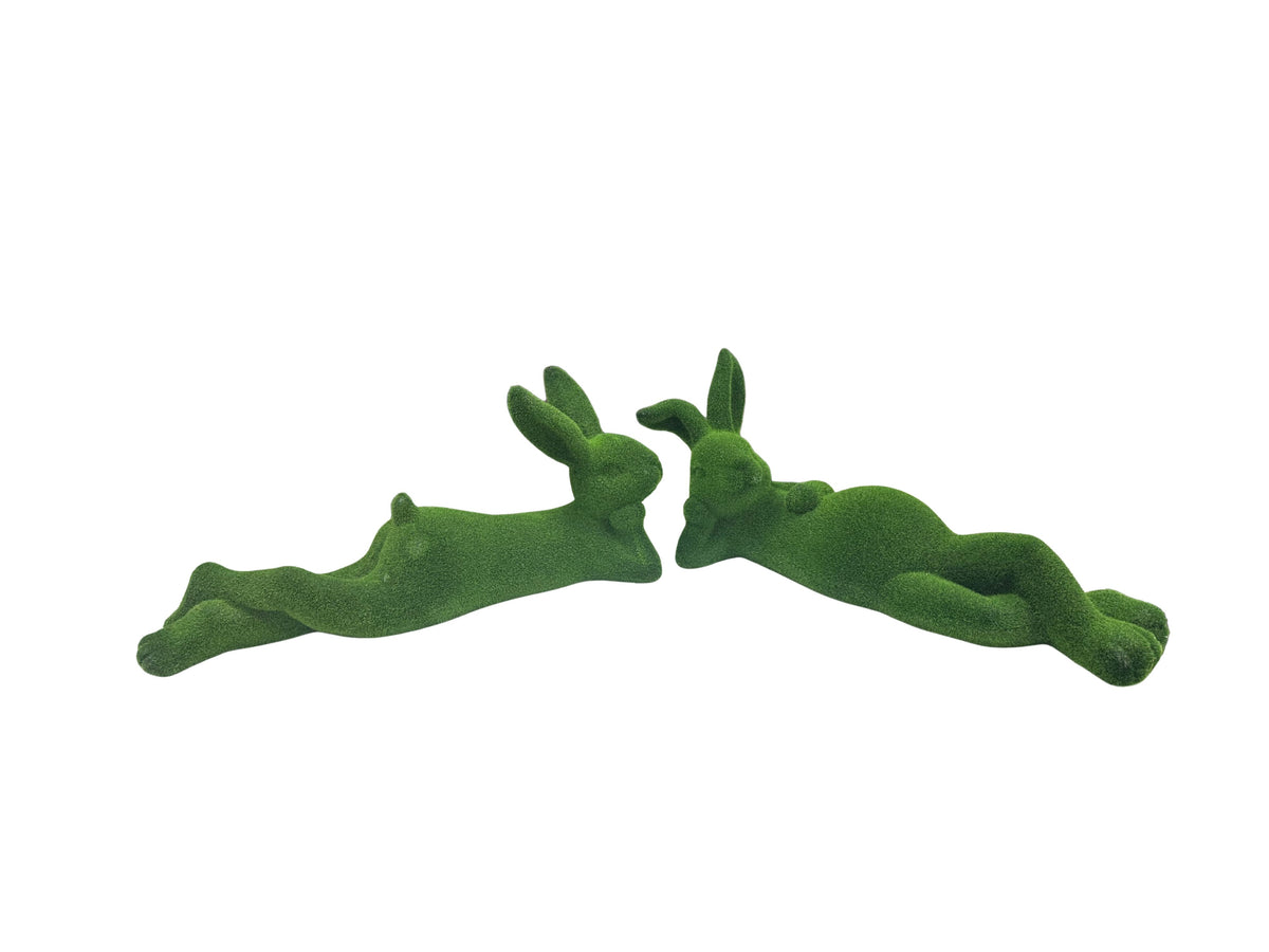 Two green moss-covered bunny figurines in a relaxed laying position, sold individually.