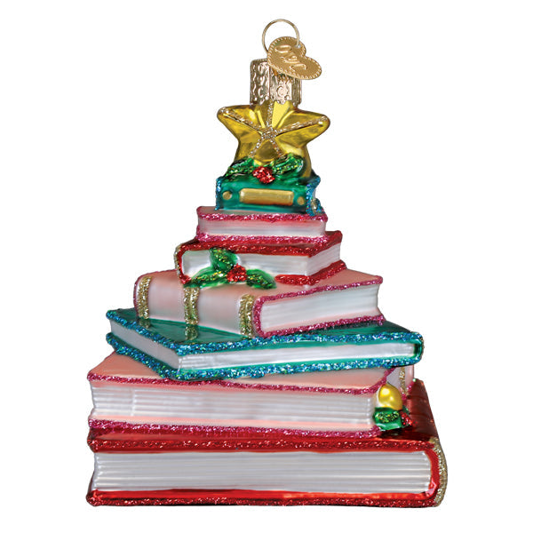 Red tree-shaped ornament with white book spine detail on a branch