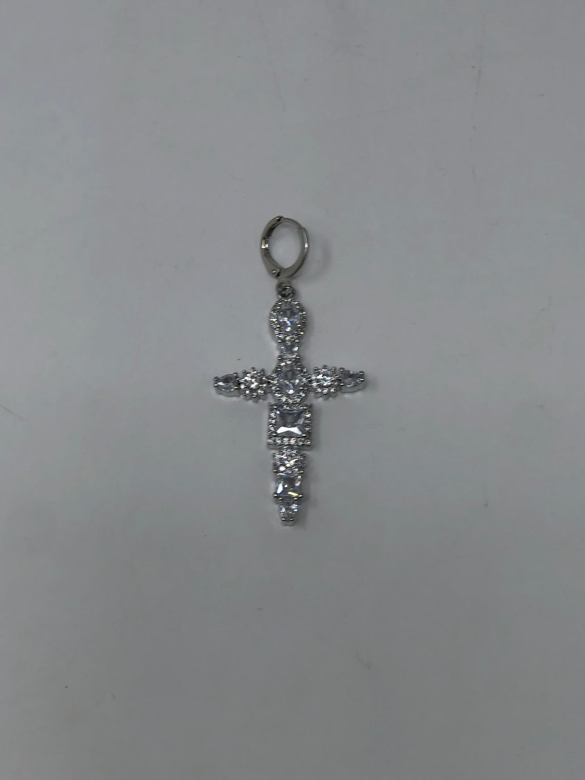 Carded Huggie Charm: an 18k gold-plated charm with cubic zirconia detail.