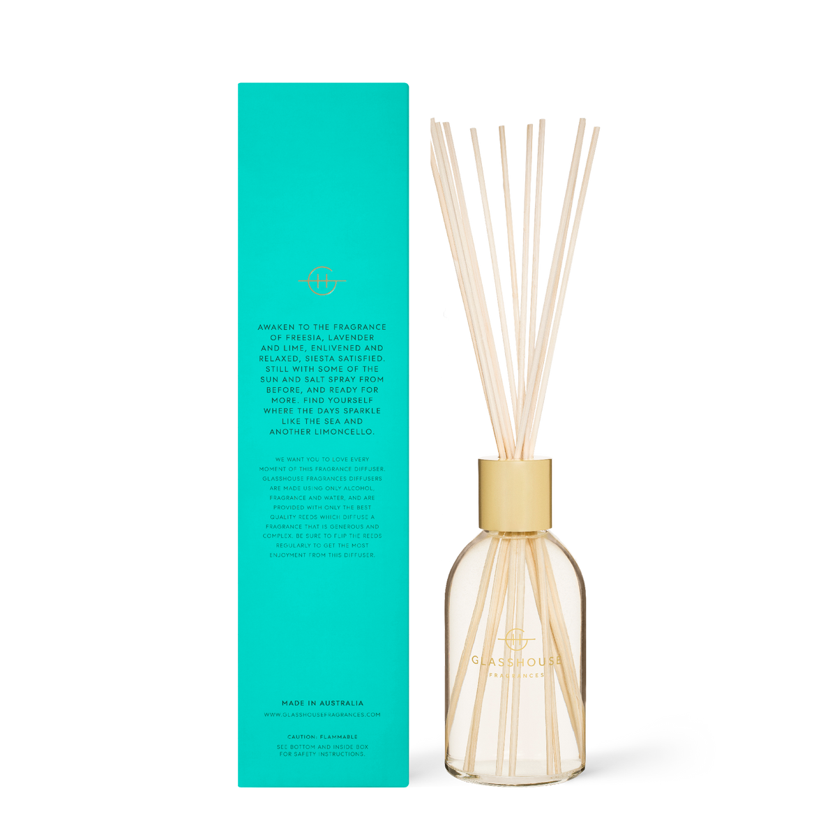 Glass diffuser bottle with 'Lost In Amalfi' label containing clear liquid and reeds