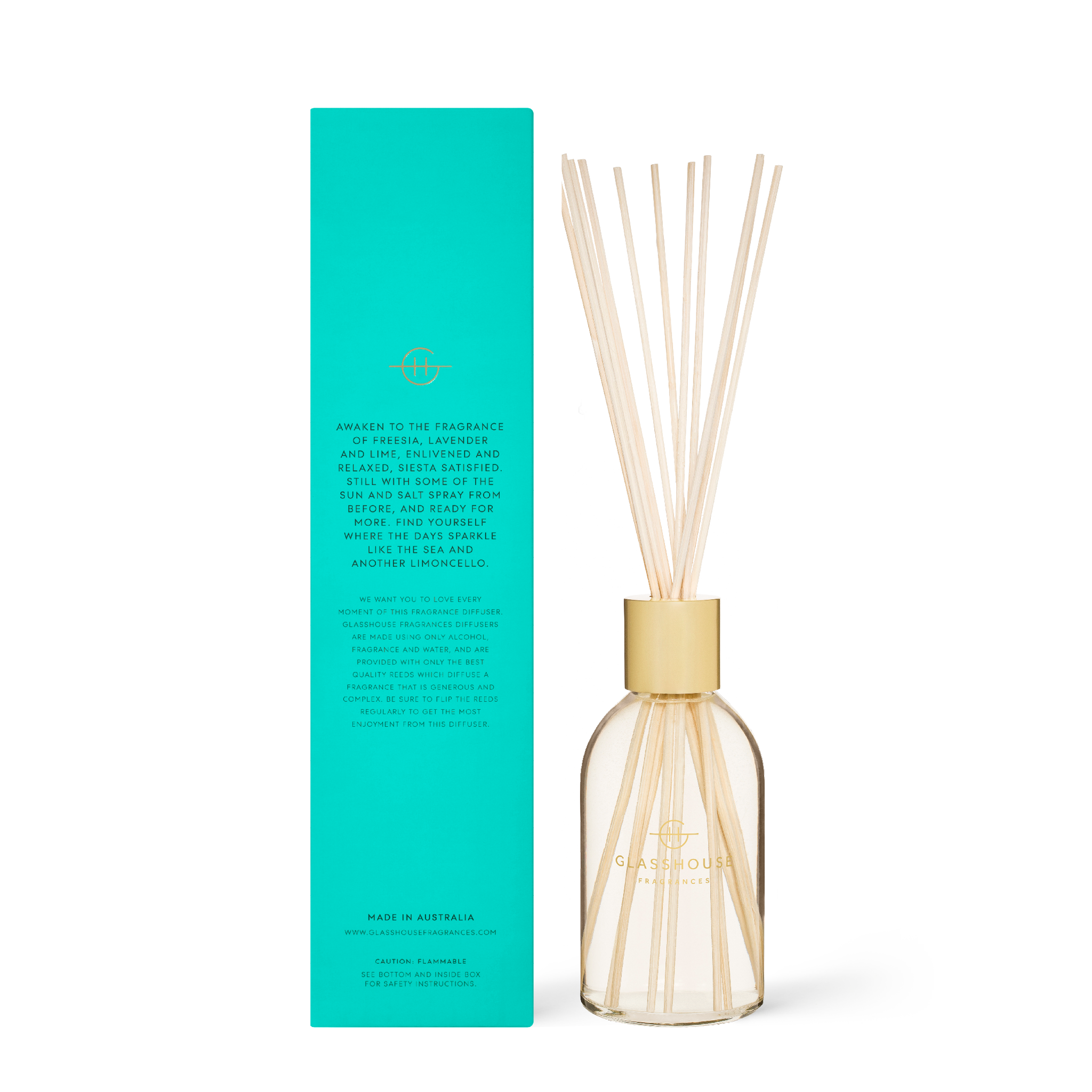 Glass diffuser bottle with 'Lost In Amalfi' label containing clear liquid and reeds