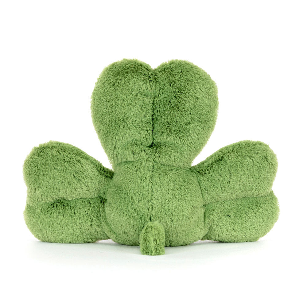 Rear view of a plush green three-leaf clover with a small stem and soft, fuzzy texture.
