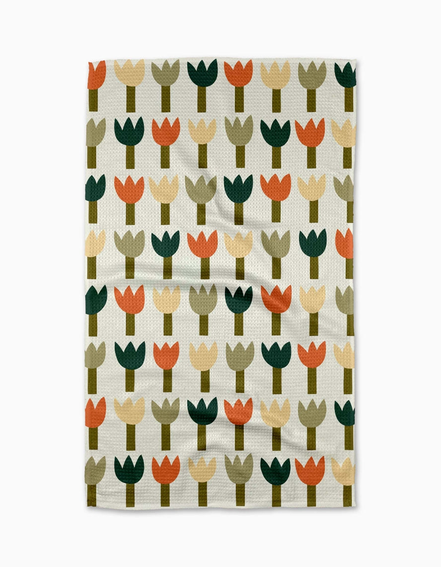Spring-themed tea towel with waffle weave construction in light blue featuring a floral pattern and hanging loop.