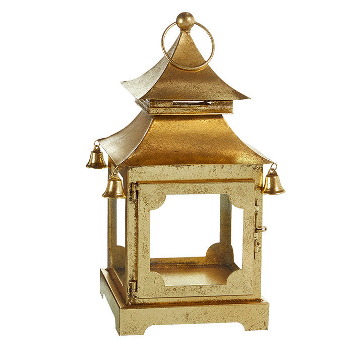 Gold iron pagoda lantern with glass panels in a tiered hexagonal silhouette.