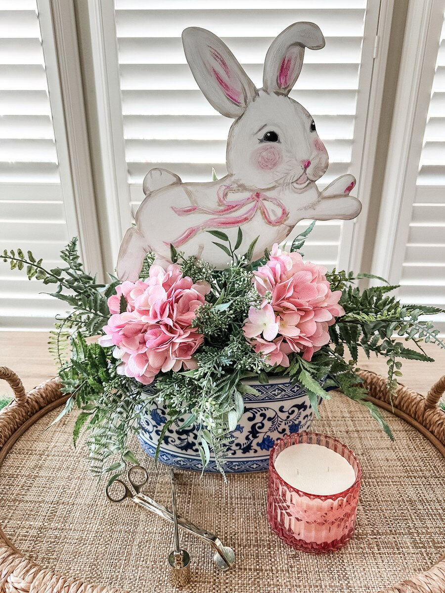 Leaping Bunny Yard stake in natural wood finish with a hanging bunny silhouette.