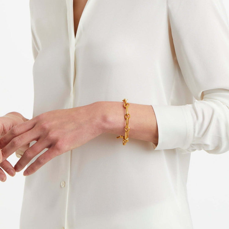 Gold Palladio link bracelet with hammered oval links and adjustable toggle closure.