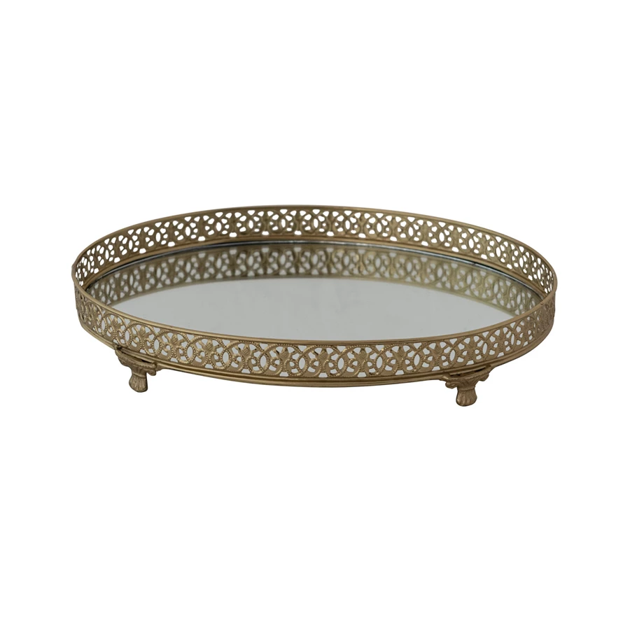 Gold-finished oval metal filigree footed tray with an attached mirror