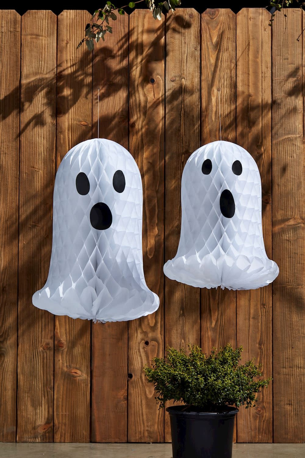 Honeycomb tissue paper decorative ghost with a translucent white color.