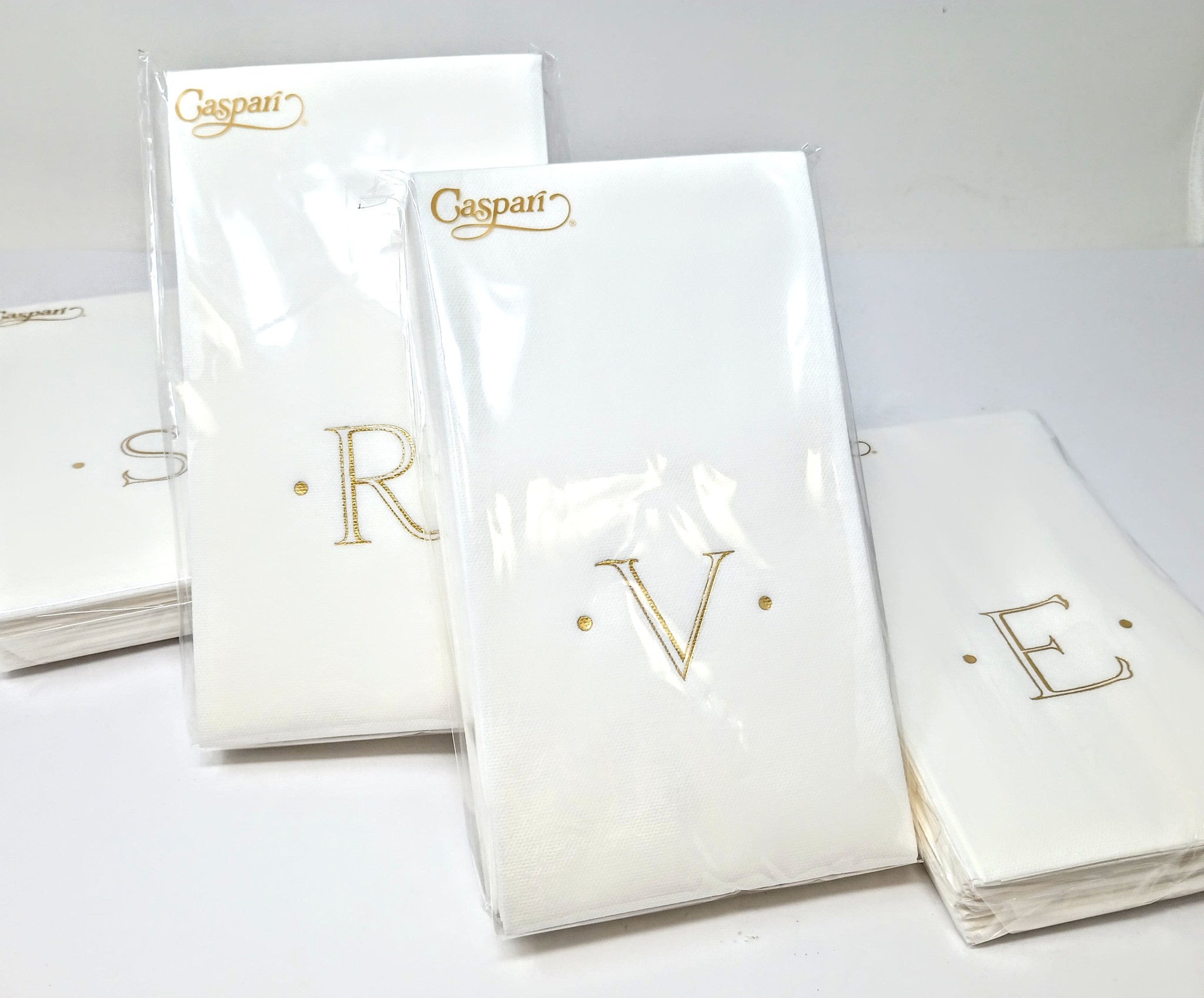 White paper linen guest napkin with a subtle textured fabric-like pattern.