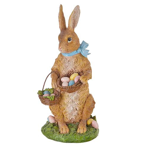 Vintage-style white ceramic rabbit figurine holding a woven basket filled with speckled eggs.