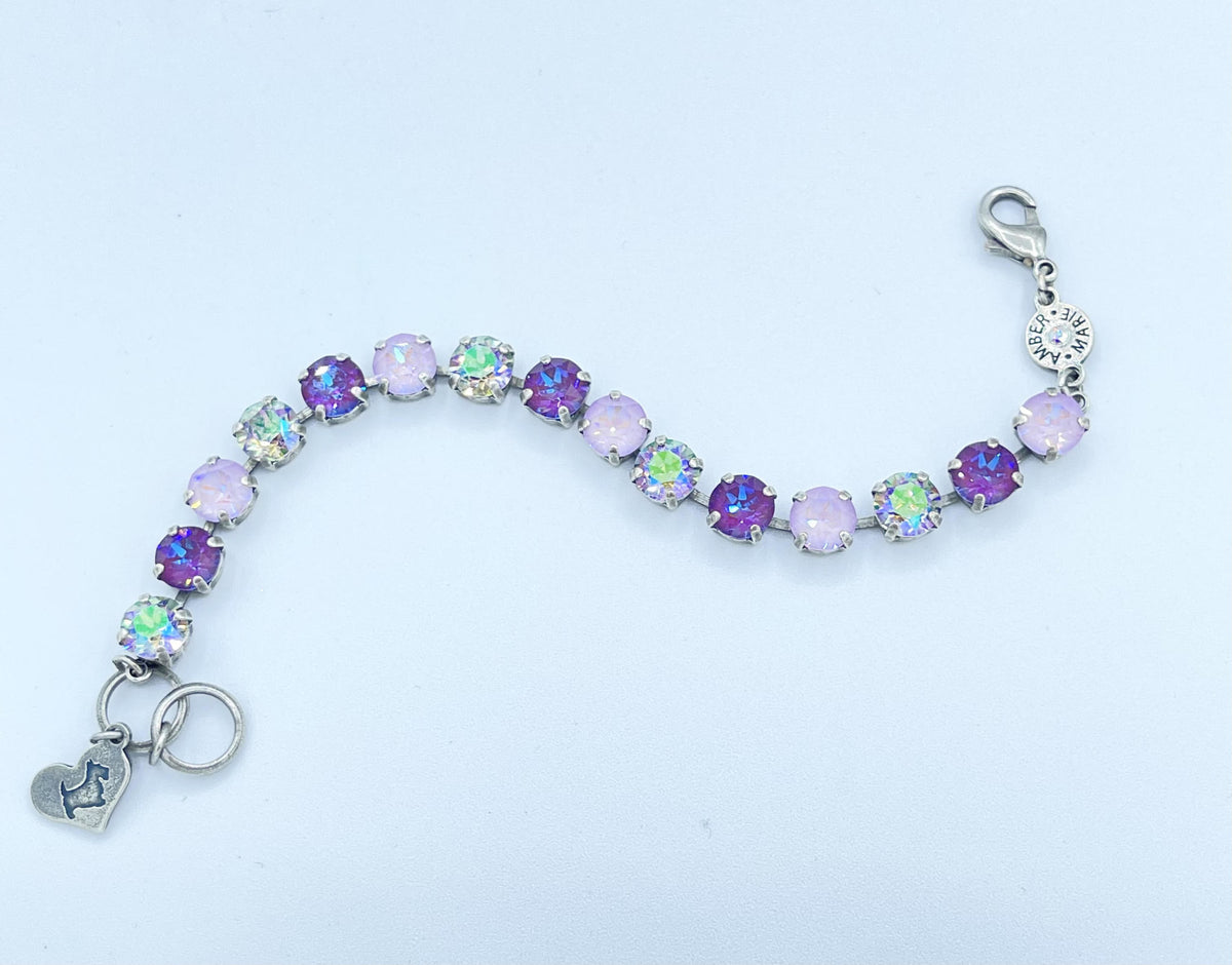 Classic Paris bracelet featuring lavender, lilac, white, and light green stones with an amber tag heart charm.