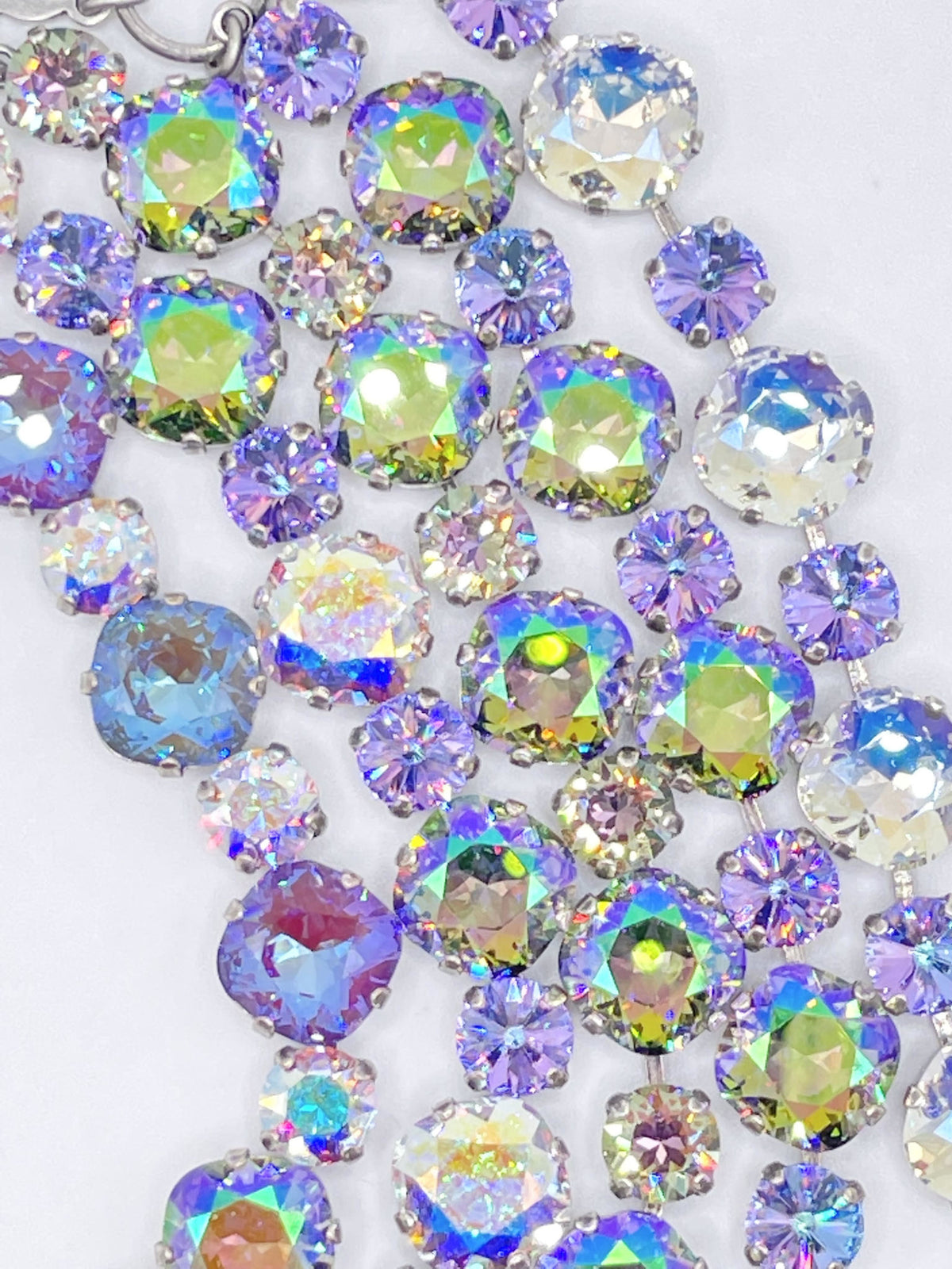 Premier Paris bracelet featuring multi-colored iridescent crystals in a layered, prong-set design.