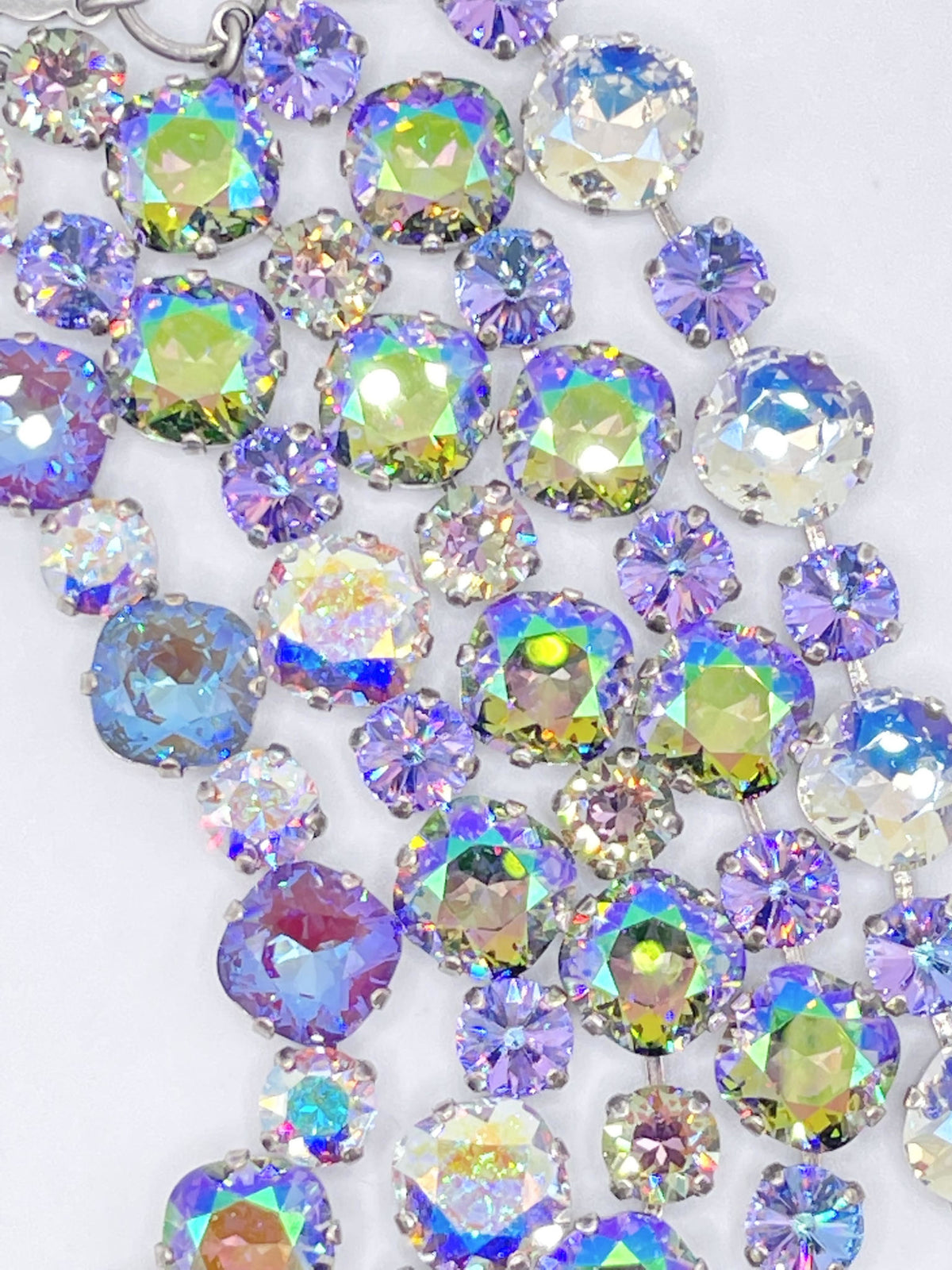 Premier Paris bracelet featuring multi-sized iridescent crystals in shades of purple and gold.