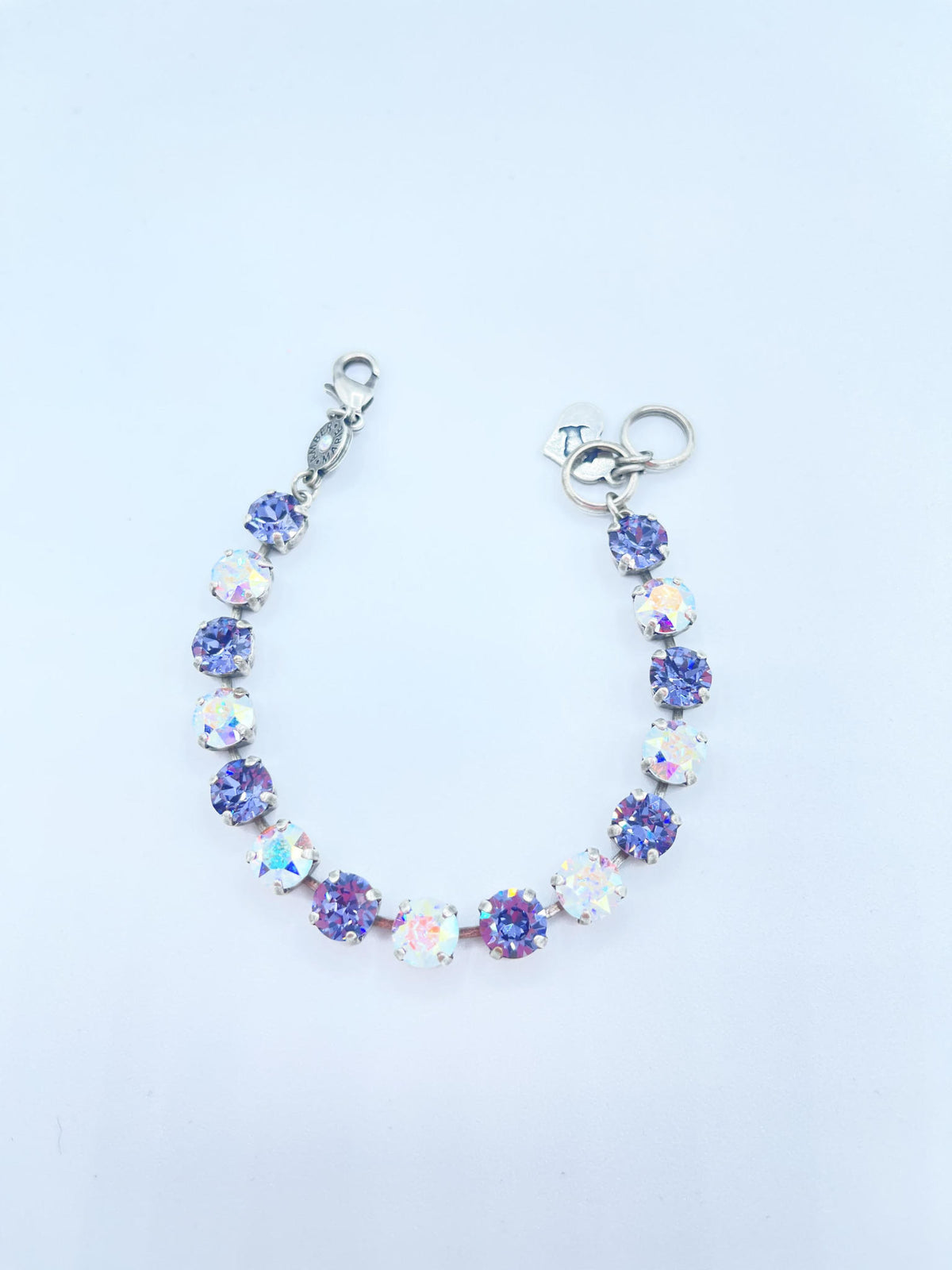Classic Paris bracelet in lavender, lilac, white, and light green stones with an amber tag heart charm.