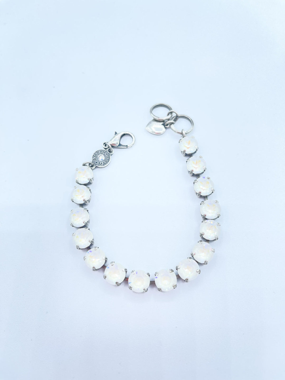 Classic Paris bracelet in lavender, lilac, white, and light green stones with an amber tag heart charm.